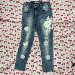 Women's Blue Jeans with White Floral Accents